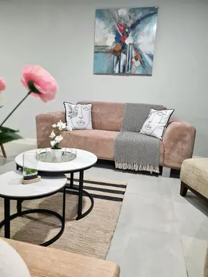 a living room with a couch and a table at Cosy Apartment at Sitari Country Estate - Somerset West in Croydon