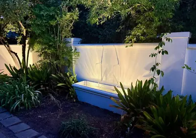 a blue tub sitting next to a white fence at Elevené - one bedroom cottage with private pool in Franschhoek