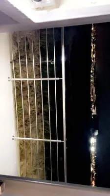 a window with a metal gate in a room at Smart and elegant space in Cape Town
