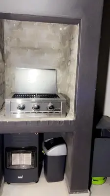 a small kitchen with a stove and a microwave at Smart and elegant space in Cape Town