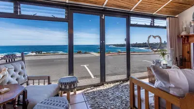 a living room with a view of the ocean at 59 Marine Hermanus in Hermanus