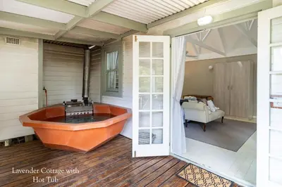 a bathroom with a tub on a house at Five Mountains Guest Farm & Spa in Wellington