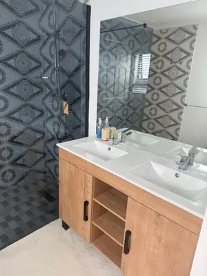 a bathroom with a white sink and a shower at Mountain View 2-Bedroom Home Near the Beach in Pringle Bay in Pringle Bay