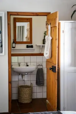 a bathroom with a sink and a mirror at Palm La Vie in Worcester
