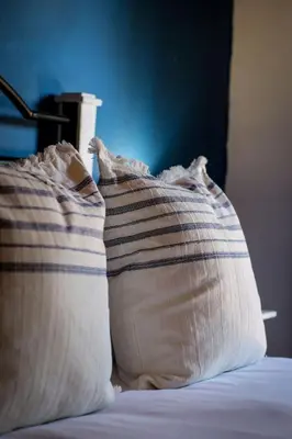 two pillows sitting on top of a bed at Palm La Vie in Worcester