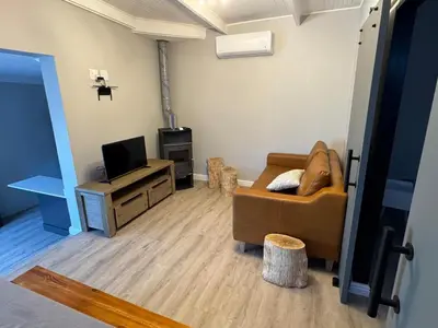 a living room with a couch and a tv at Alicante self-catering 2 Bedroom apartment sleeps 4 in Worcester