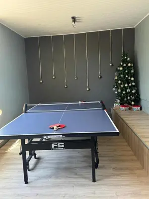 a ping pong table in a room with a christmas tree at Alicante self-catering 2 Bedroom apartment sleeps 4 in Worcester