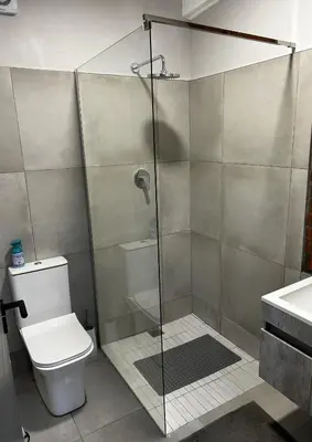 a bathroom with a shower with a toilet and a sink at Alicante self-catering 2 Bedroom apartment sleeps 4 in Worcester