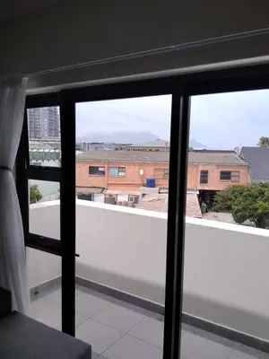 a view from a window of a building at EasyCapeTown - Bloubergstrand coastal apartment in Cape Town