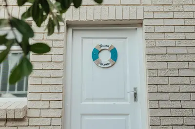 a wreath on a door of a brick building at Seabreeze in Hermanus
