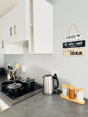 a kitchen with two pots and pans on a stove at Worcester Cozy Stay - Apto 2 in Worcester