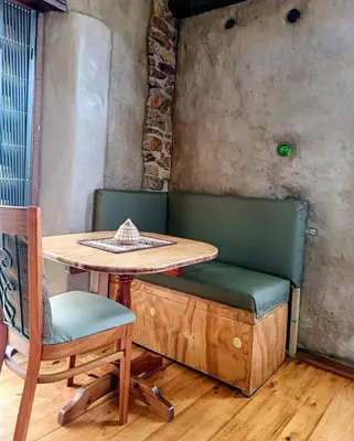 a table and chairs in a room with a table at Serene, cosy stay with a mountain view in Greyton