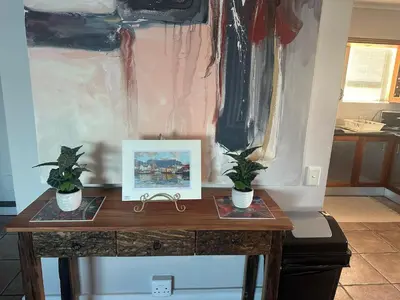a table with two potted plants on top of it at Pips Place Penthouse 501 in Strand