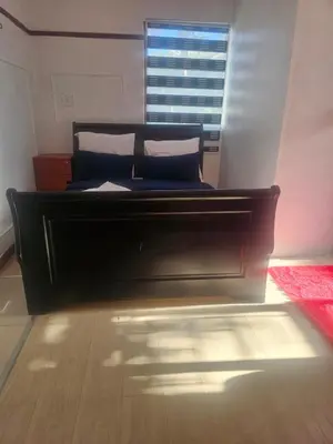 a bed sitting in a room with a window at Ludinz Self Catering Accommodation in Avondale