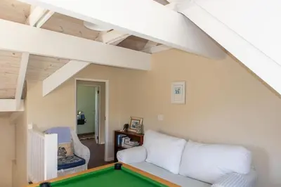 a living room with a pool table at Porcupine Creek in Pringle Bay