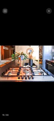 a stove top with pots and pans on top of it at Beach House Living in Gordonʼs Bay