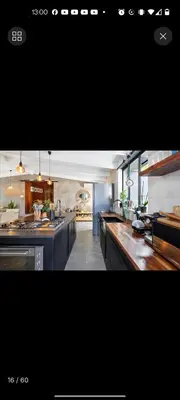 a view of a kitchen with counters and appliances at Beach House Living in Gordonʼs Bay