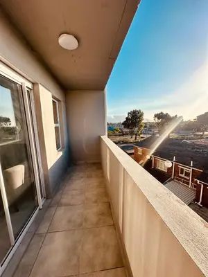 an empty balcony with a view of a city at Table Mountain View Apartment II in Cape Town