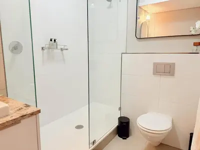 a bathroom with a shower and a toilet at Instellies Self Catering Apartment in Stellenbosch