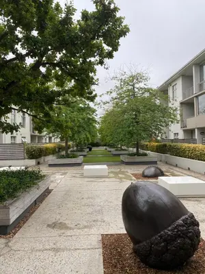 a courtyard with a large black sculpture in front of a building at Instellies Self Catering Apartment in Stellenbosch