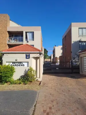 a building with a sign that reads utility gardens at Central 3rd Floor Durbanville Apartment in Durbanville