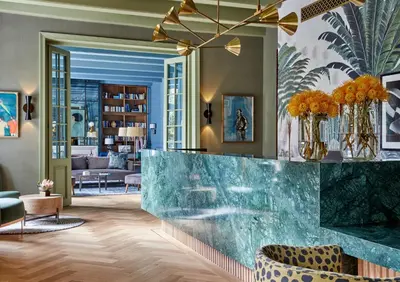 a lobby with a green marble counter and chairs at Erinvale Estate Hotel & Spa in Somerset West