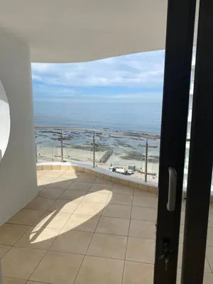 a room with a view of the ocean from a balcony at Koras little heaven in Strand