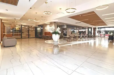 a lobby with a vase of flowers on a table at City Vibes and Mountain Highs 2 Bed, 2 Bath Apart