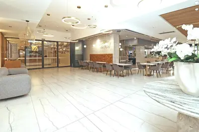 a dining room with tables and chairs in a restaurant at City Vibes and Mountain Highs 2 Bed, 2 Bath Apart