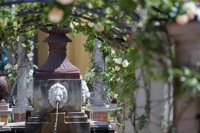 a fountain with a statue of a bird on it at Franschhoek Country House & Villas in Franschhoek
