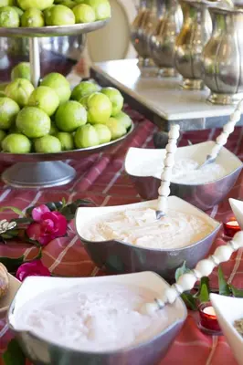 a table with bowls of dip and plates of apples at Franschhoek Country House & Villas in Franschhoek