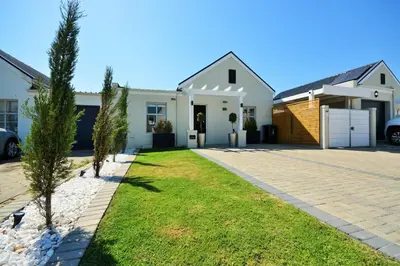 a house with a driveway in front of it at Montbleu 3 Bed 3 Bath House in residential security Estate in Stellenbosch