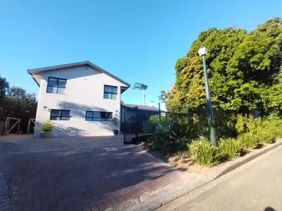 a white house with a street light in front of it at Pelikaan 5 in Stellenbosch