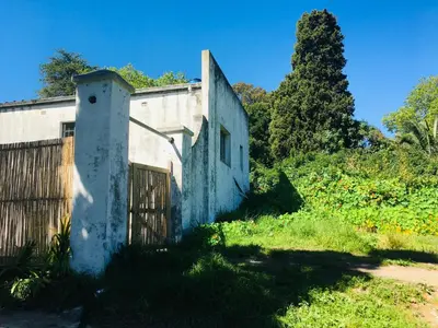 an old house on a hill with a fence at The Barn, at Glenora Avenue in Somerset West