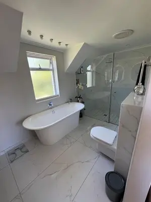a bathroom with a tub and a shower and a toilet at 9 Charme in Stellenbosch
