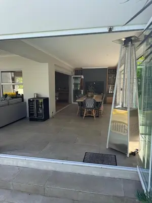 a porch with a swing in a house at 9 Charme in Stellenbosch