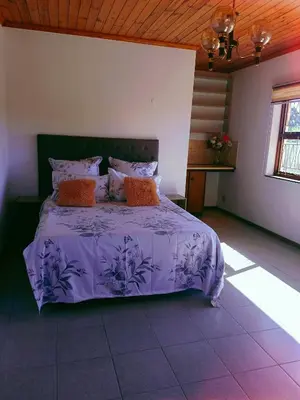 a bedroom with a purple bed in a room at ABSD home in Avondale