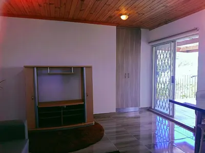 a living room with a large flat screen tv at ABSD home in Avondale