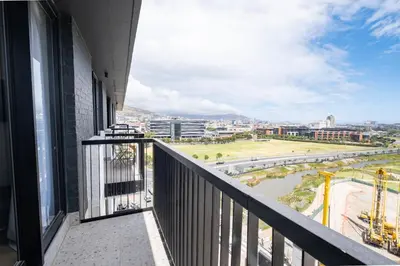 a balcony with a view of a city at 805 Riverlands - Lux Studio Apartment in Cape Town