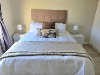 a bed with two teddy bears on top of it at 2 Bedroom house at Tweespruit - Pet friendly in Stellenbosch