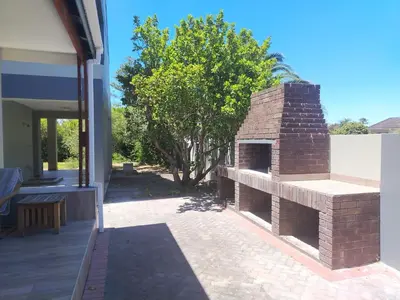an outdoor brick oven on the side of a house at Art House on Main in Hermanus