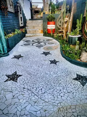 a stone walkway with stars on the ground at Anna's Studio in Strand