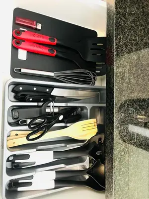 a drawer full of utensils in a box at 144 Mayfair Discerning Luxury and Ultimate Comfort in Cape Town