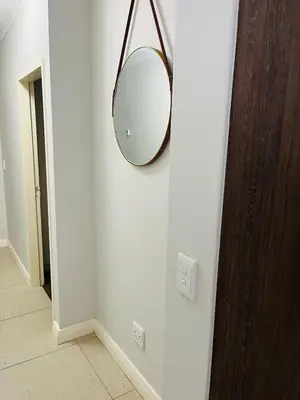 a mirror hanging on a wall in a room at 144 Mayfair Discerning Luxury and Ultimate Comfort in Cape Town