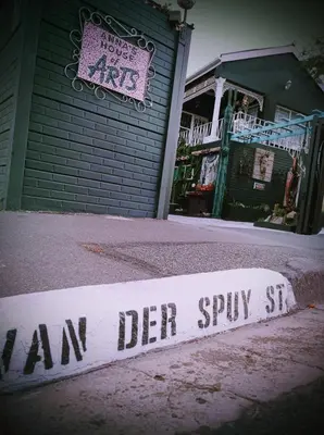 a sign that says am der spry in front of a store at Anna's House of Arts in Strand