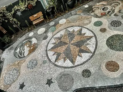 a mosaic tile floor with stars on it at Anna's House of Arts in Strand