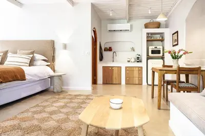 a living room with a bed and a coffee table at The Oak Cottage in Wellington