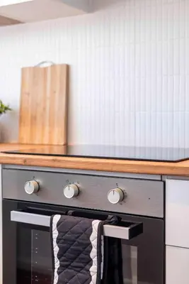 a kitchen with a counter with a stove top at First floor Claremont Studio apartment in Cape Town