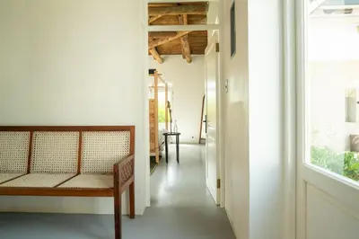 a hallway with a bench and a window at Drakenskloof - Exclusive-Use Mountain Homestead