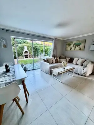 a living room with a couch and a table at 3at33 CT in Cape Town